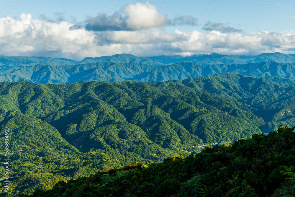 Layers of magnificent mountains and clear clouds background in Taiwan. 