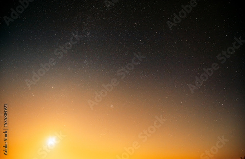 Natural real night sky stars background. Natural starry sky and sun background backdrop. Sunset, sunrise.