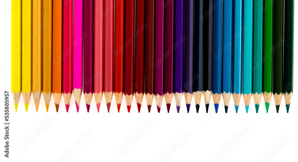 A row of color pencils on white background A row of color pencils on white background