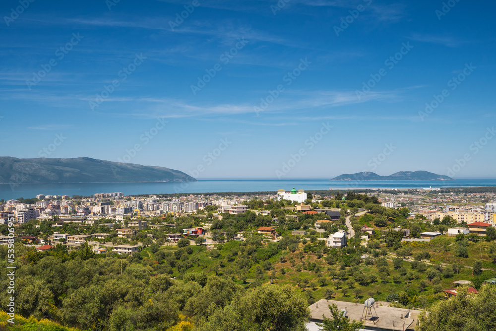 Attractive spring cityscape of Vlore city from Kanines fortress. Captivating morning sescape of Adriatic sea. Spectacular outdoor scene of Albania, Europe. Traveling concept background