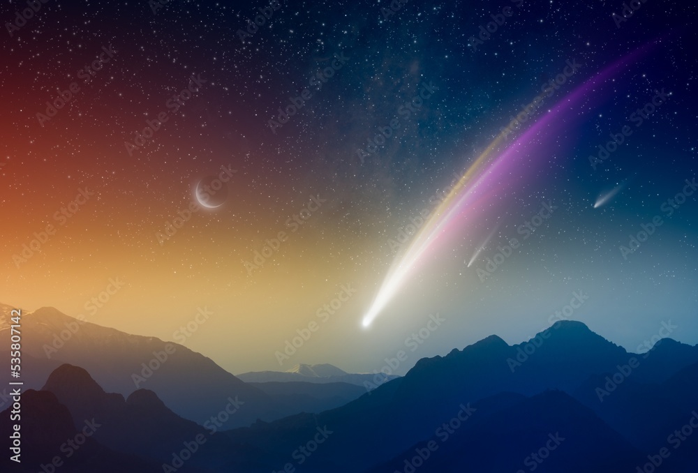 Amazing unreal background: giant colorful comet in glowing sunset sky over mountains. Comet is icy small Solar System body.