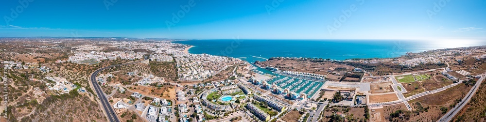 Sensational aerial panorama of Albufeira city. View of port of Albufeira with luxury urbanisation. At left the city of Albufeira. Famous travel destination in Algarve, Portugal. 21 merged images