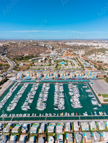 Vertical photography of luxury Albufeira harbour. Perspective from drone. Luxury and famous travel destination in south of Portugal.  photo