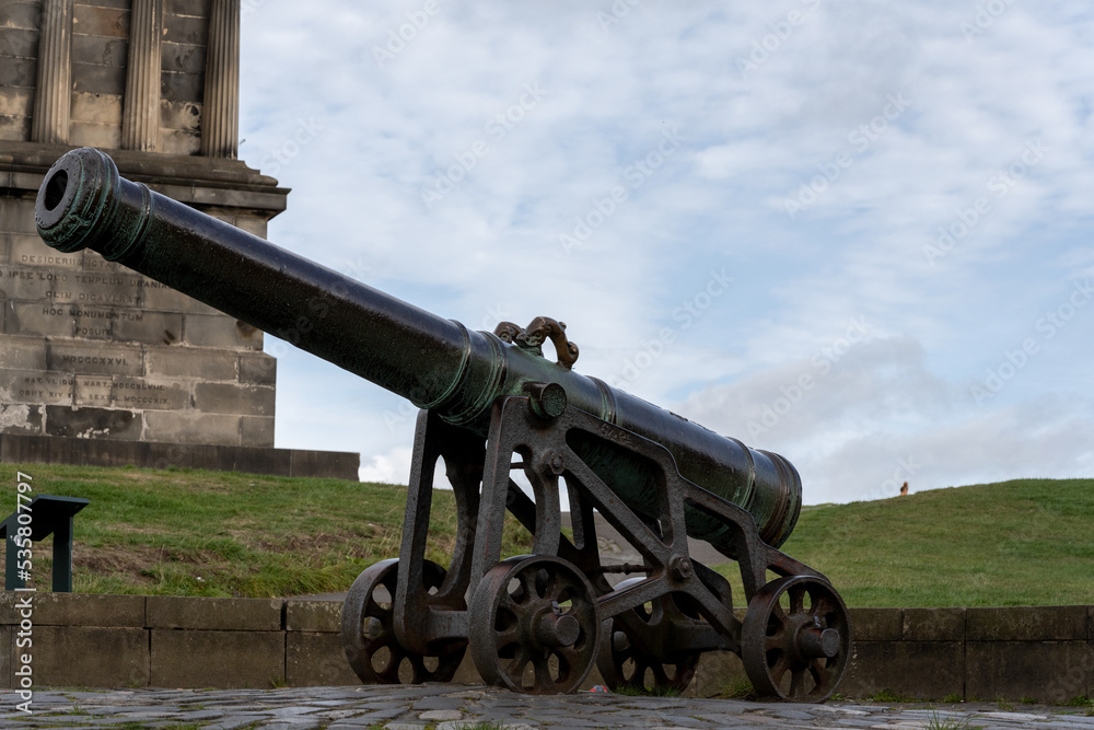 cannon on Calton hill with neoclassical monuments cannon on Calton hill with neoclassical monuments