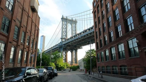 Walking Along Washington Street In The Dumbo Neighborhood Of Brooklyn With Manhattan Bridge View In New York, USA. Dolly Shot photo