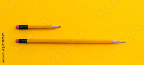 Принти на полотні Long and short pencils on yellow background