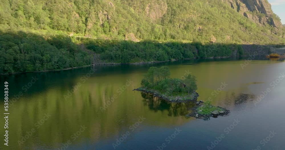 Picturesque Small Island With A Red House In Lovrafjorden Fjord, Norway. Aerial Drone Shot Picturesque Small Island With A Red House In Lovrafjorden Fjord, Norway. Aerial Drone Shot