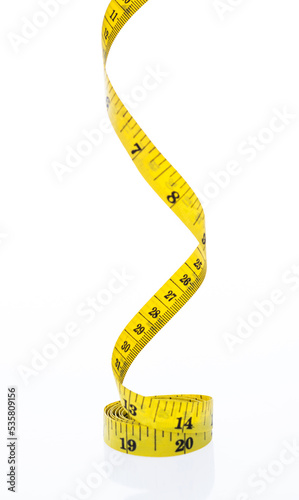 Yellow measuring tape on white background