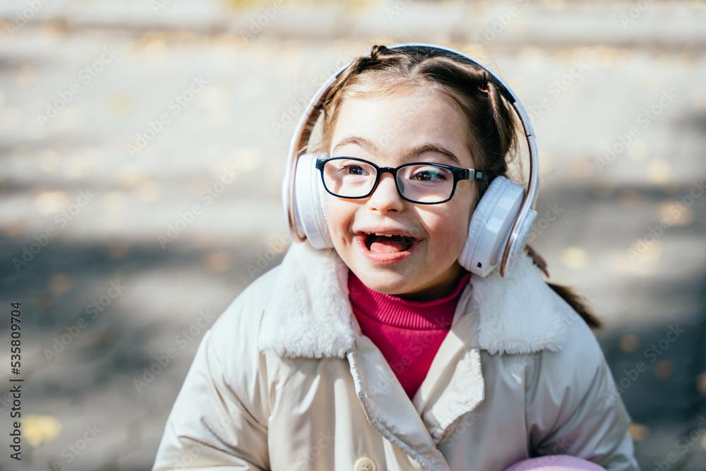 Happy disability kid outdoor portrait. Special need child happy