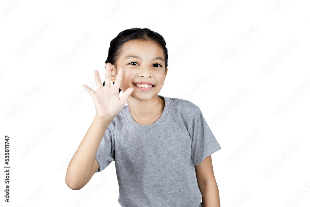 Close up asian little girl smiling happy positive attractive waving hand greeting say hi hello isolated on white background with clipping path.studio portrait. Close up asian little girl smiling happy positive attractive waving hand greeting say hi hello isolated on white background with clipping path.studio portrait.