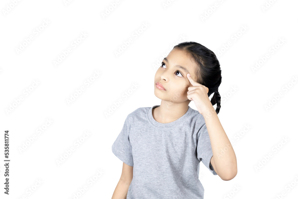 Asian little girl use finger pointing to her head looking at product or empty copy space while standing over isolated on white background with clipping path. Asian little girl use finger pointing to her head looking at product or empty copy space while standing over isolated on white background with clipping path.