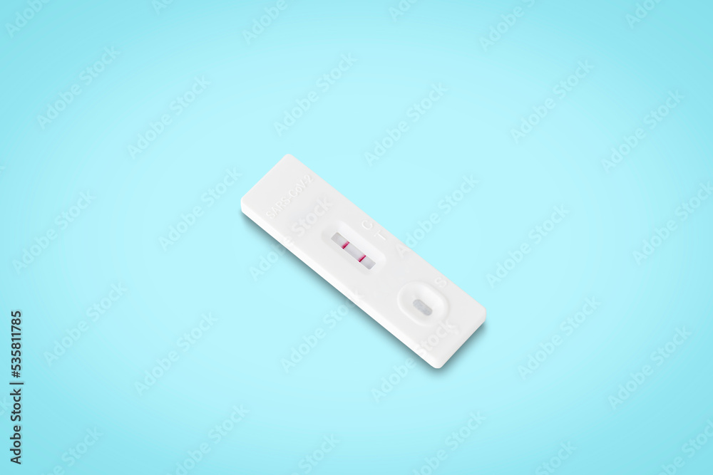 covid-19 positive test result. antigen (ATK) test kit isolated on light blue background with clipping path. top view. flat lay. covid-19 positive test result. antigen (ATK) test kit isolated on light blue background with clipping path. top view. flat lay.