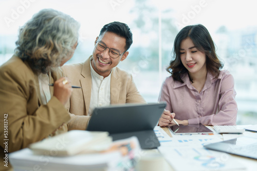 Asian entrepreneurs and business people meeting in a conference room in business planning, financial budget and investment risk assessment to analyze customer groups to increase company growth © Jirapong