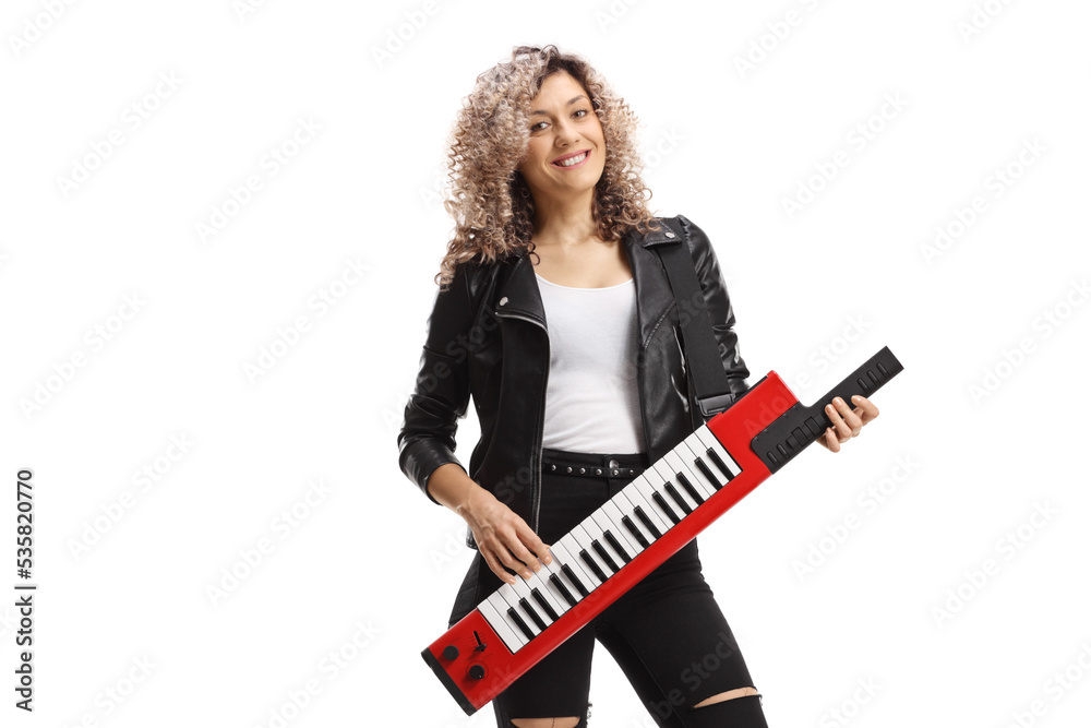 Female musician playing a keytar synthesizer Female musician playing a keytar synthesizer