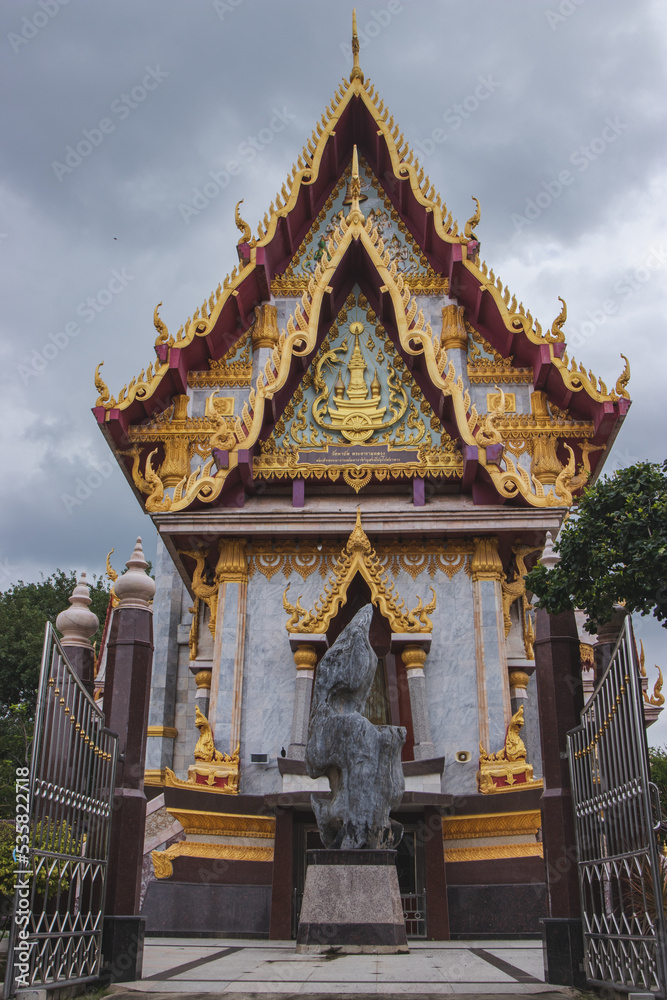 Golden pagoda in Northeastern of Thailand, Pagoda is on rainy cloud background. Golden pagoda in Northeastern of Thailand, Pagoda is on rainy cloud background.
