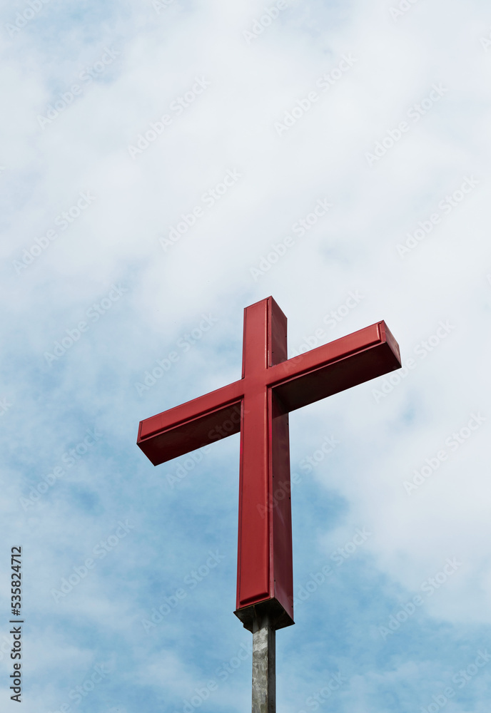 A cross under the cloudy sky