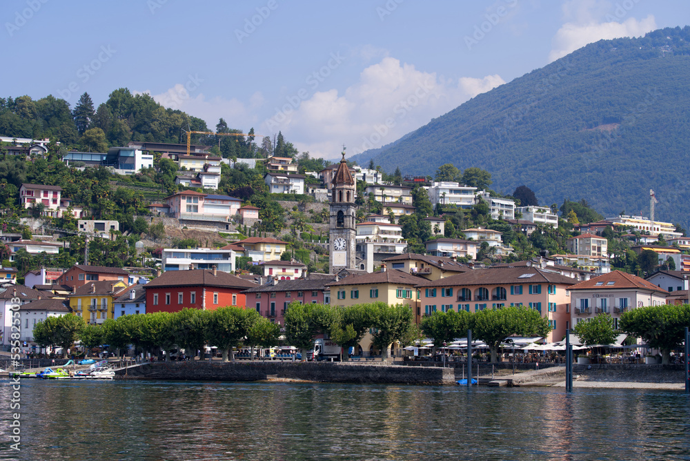 Beautiful view of village Ascona, Canton Ticino, on a sunny summer day with Lago Maggiore in the foreground. Photo taken July 25, 2022, Ascona, Switzerland.