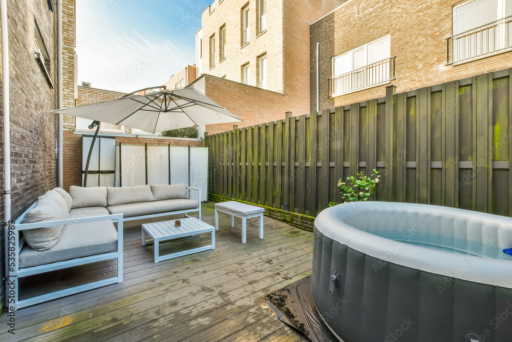 Patio of building with table bench and pool Patio of building with table bench and pool