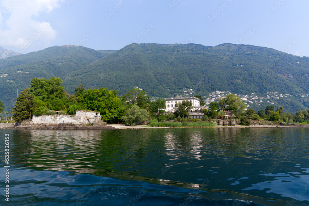 Fototapeta premium Beautiful Brisago Islands seen from passenger ship on a sunny summer day. Photo taken July 25th, 2022, Brisago Islands, Switzerland.