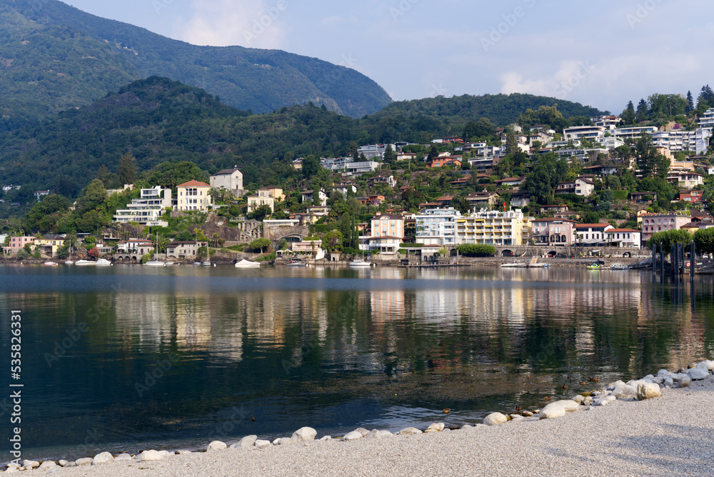 Lake shore of Lake Lago Maggiore at village Ascona, Canton Ticino, on a sunny summer day. Photo taken July 24th, 2022, Ascona, Switzerland. Lake shore of Lake Lago Maggiore at village Ascona, Canton Ticino, on a sunny summer day. Photo taken July 24th, 2022, Ascona, Switzerland.