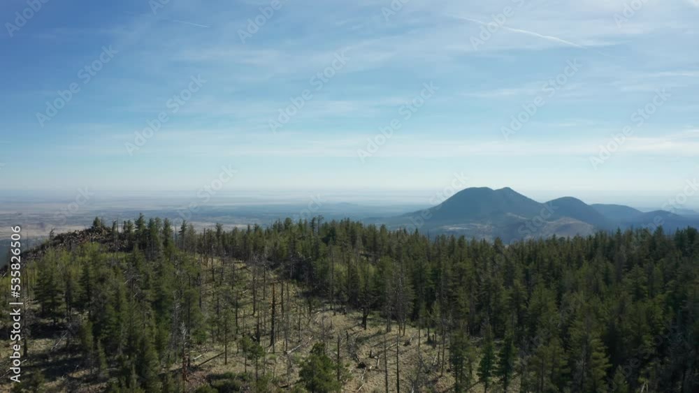 Sunset Crater Volcano National Monument in the distance, from the air Sunset Crater Volcano National Monument in the distance, from the air