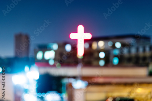 Defocused blur of building with cross photo