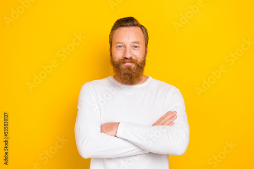 Photo of smiling experienced redhair expert guy wear white shirt crossed hands confident trainer ad isolated on yellow color background