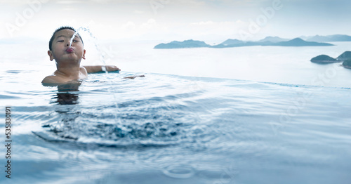 Photos Boy swimming and spitting water from mouth