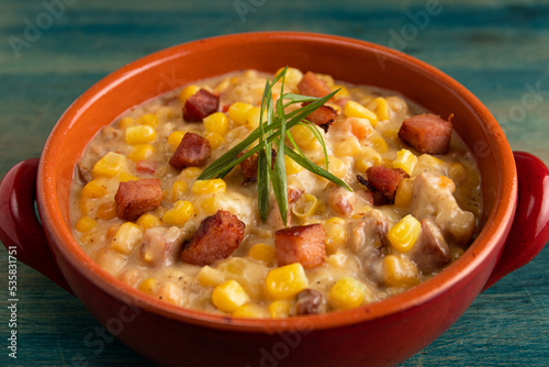 Sweet corn soup with bacon and persil.