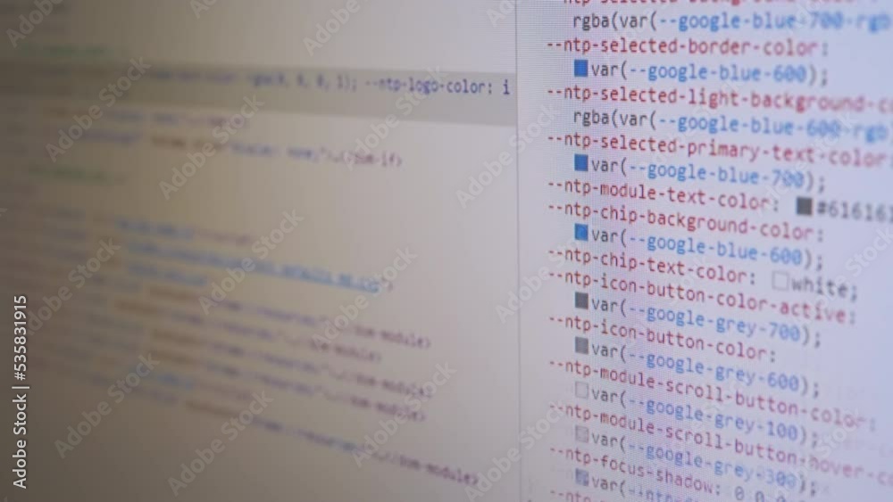 Programmer Views the HTML Code of the Page on a Screen of a Computer ...