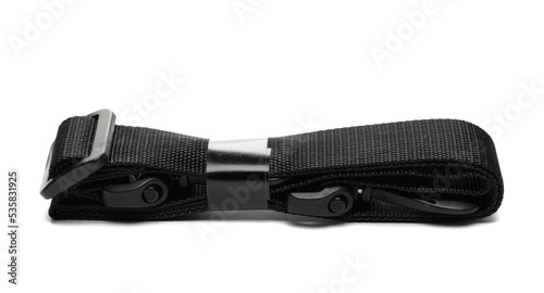 Black new unpacked nylon fastening belt, strap for purse isolated on white 