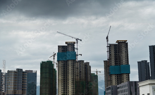 Unfinished building under gray cloud sky