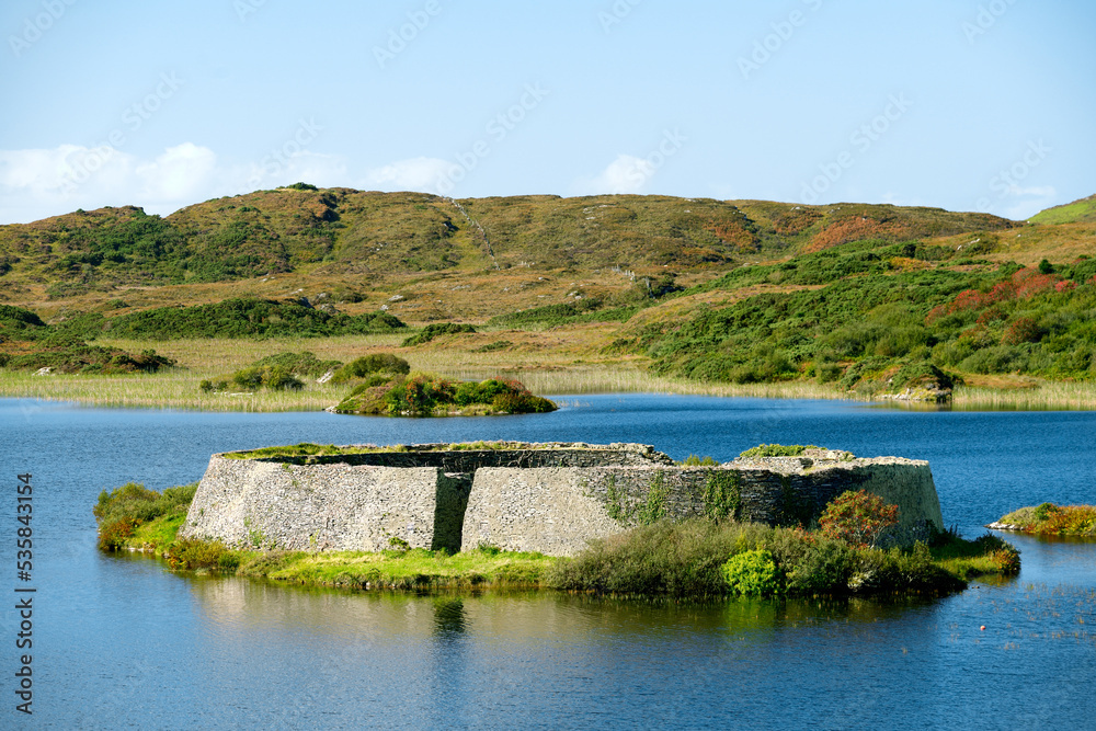 Doon Fort prehistoric stone cashel caiseal or dun. Pre Christian refuge on small crannog lake isle in Doon Lough near Ardara, Donegal, Ireland
