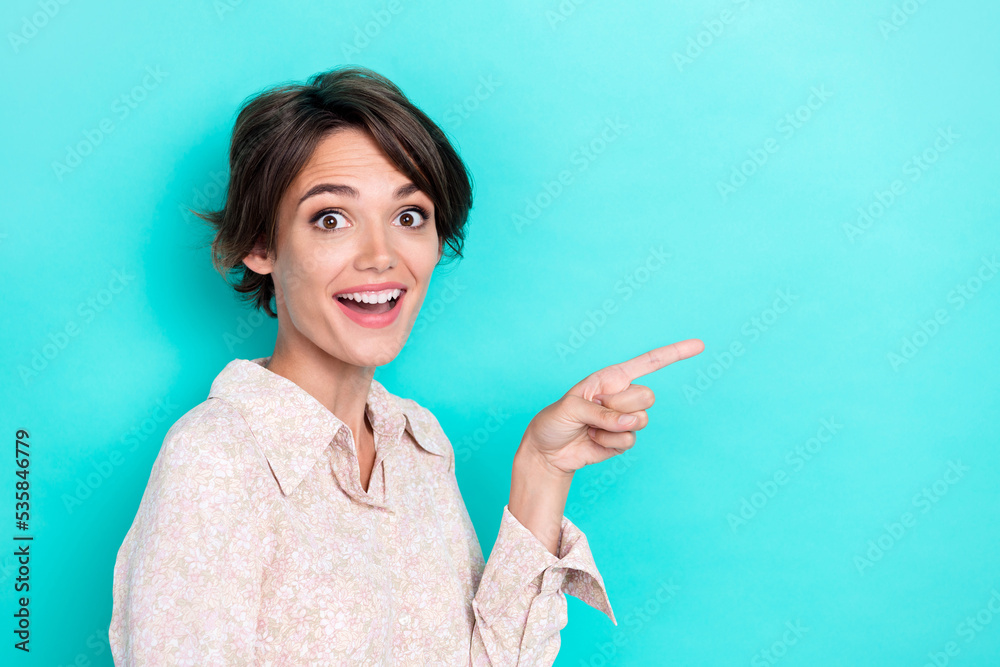 Photo of funky bob hairdo millennial lady index promo wear white shirt isolated on teal color background Photo of funky bob hairdo millennial lady index promo wear white shirt isolated on teal color background