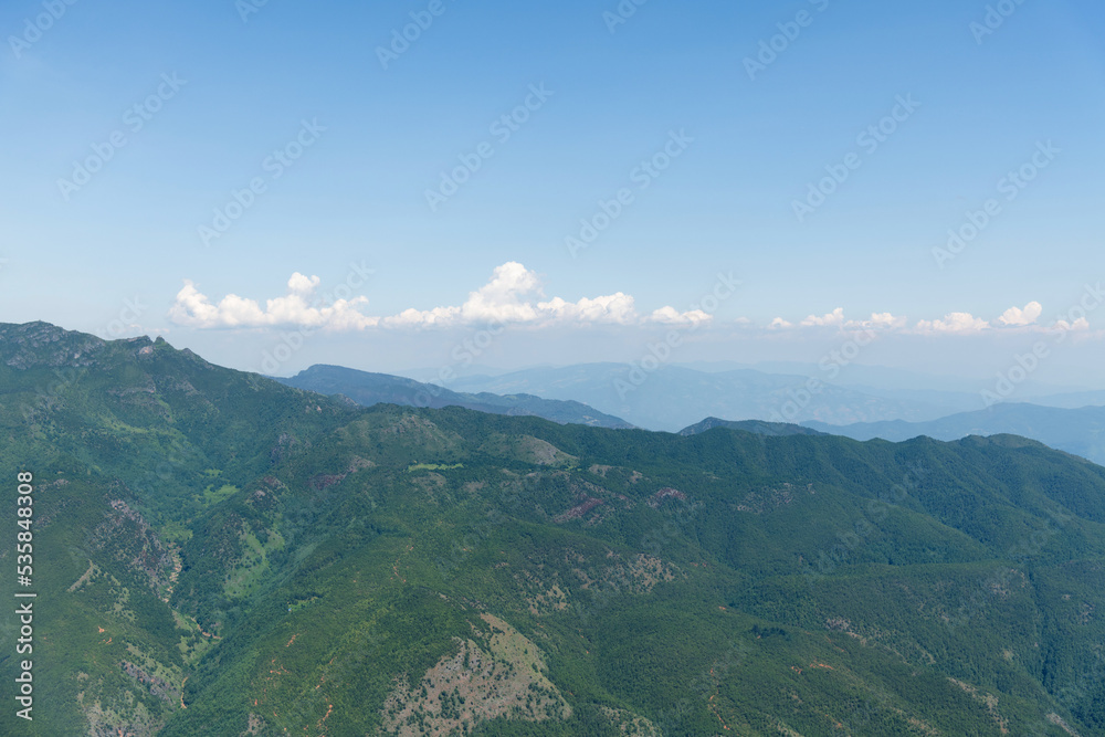 Aerial view of mountains covered with forests in summer Aerial view of mountains covered with forests in summer