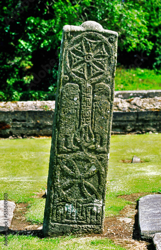 Solar sun disc style early Celtic Christian cross stone in churchyard beside the Carndonagh High Cross, Co. Donegal, Ireland.