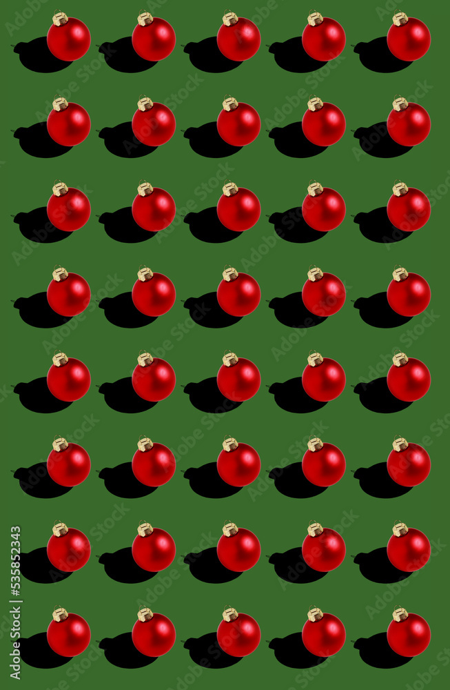seamless red Christmas balls pattern on green background 