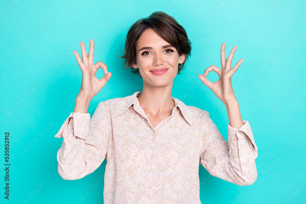 Closeup photo of young gorgeous pretty lady businesswoman wear office pink cute shirt showing okey sign two hands alright isolated on aquamarine color background Closeup photo of young gorgeous pretty lady businesswoman wear office pink cute shirt showing okey sign two hands alright isolated on aquamarine color background