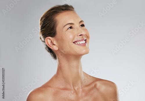 Skincare, face and portrait of model woman with smile for facial, health and skin for mockup in studio background. Cosmetics, happy and senior female with beauty, wellness and cosmetic makeup care.
