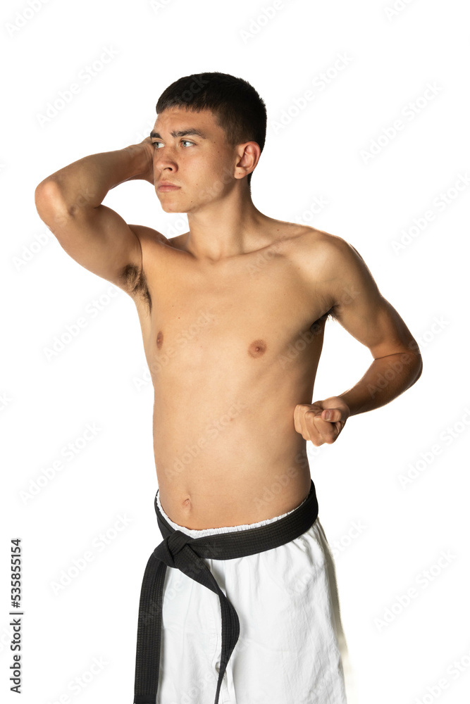 Fototapeta premium A Shirtless 19 Year Old Practacing a Karate Elbow Strike