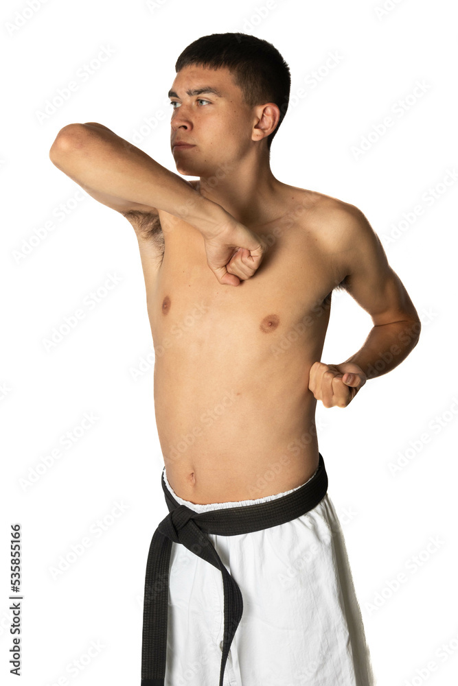 Fototapeta premium A Shirtless 19 Year Old Practacing a Karate Elbow Strike