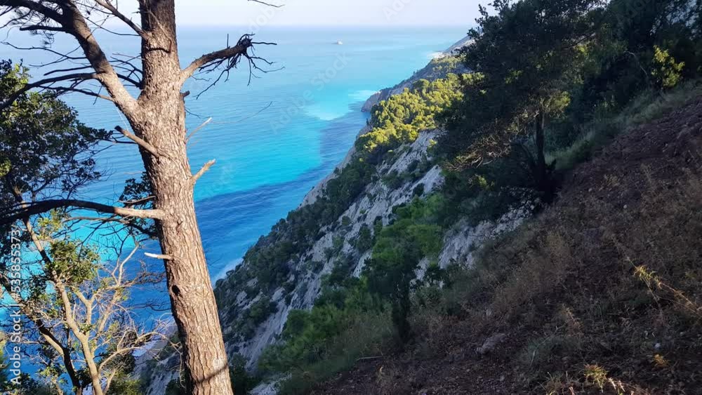 The beautiful turquoise blue color of the Ionian Sea that surrounds the Greek island of Lefkada and Potro Katsiki beach The beautiful turquoise blue color of the Ionian Sea that surrounds the Greek island of Lefkada and Potro Katsiki beach