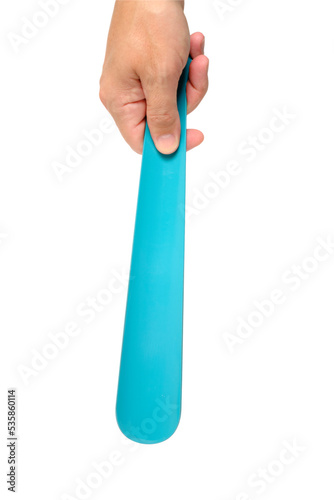 Shoe spoon in hand, on a white background.