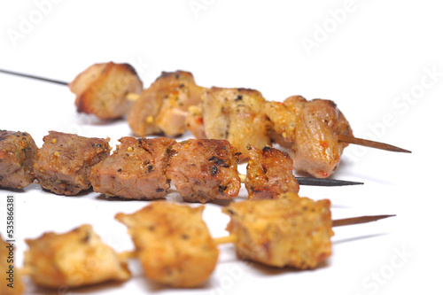 Homemade chicken barbecue on skewers served on crepe