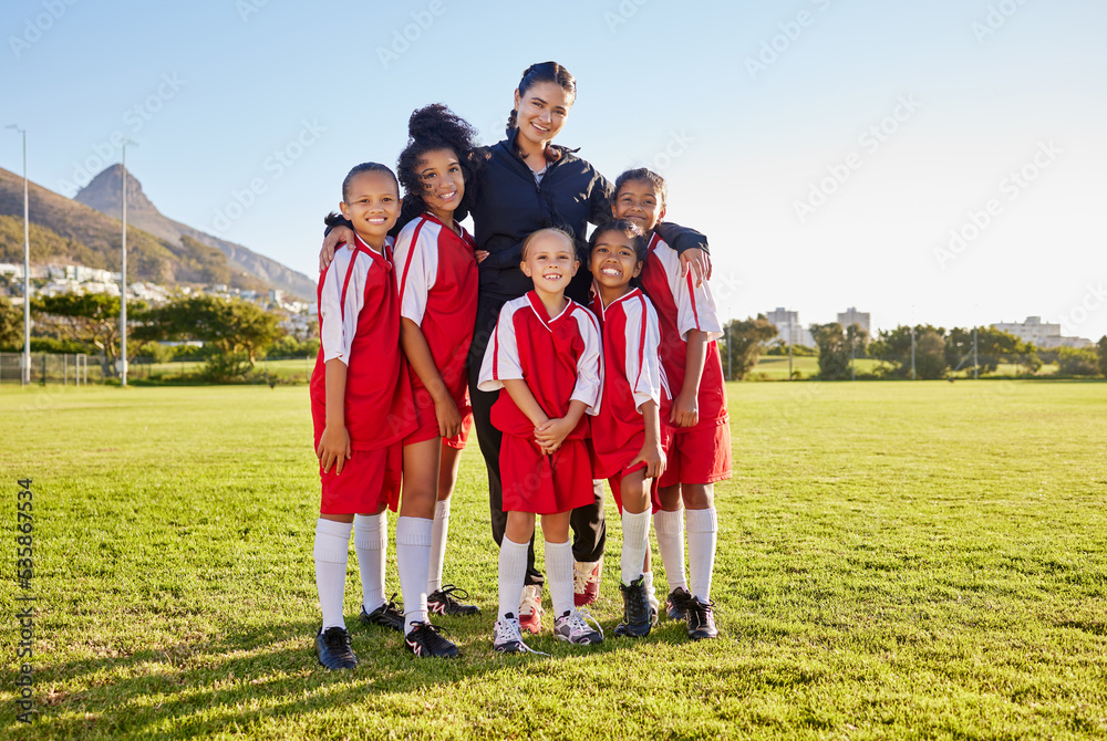 Obraz premium Team, soccer and coach smile on field together in portrait after training, game or workout in sun. Football, girl and woman with diversity in happy sports group on grass for teamwork in Cape Town