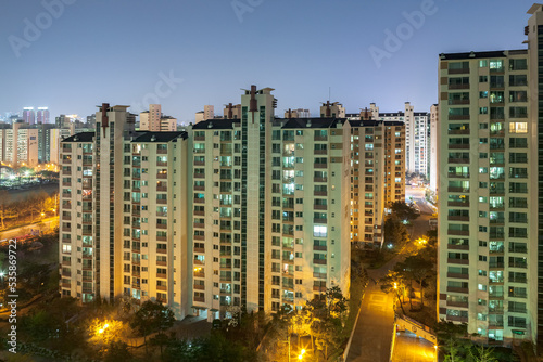 BUCHEON, SOUTH KOREA: aerial view of typical apartment buidings (called Danji in Korean) at night with illuminated individual appartments photo