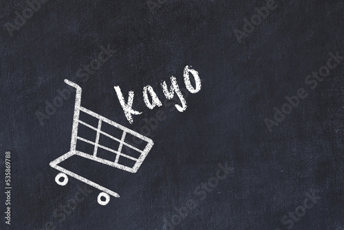 Konstfotografi Chalk drawing of shopping cart and word kayo on black chalboard