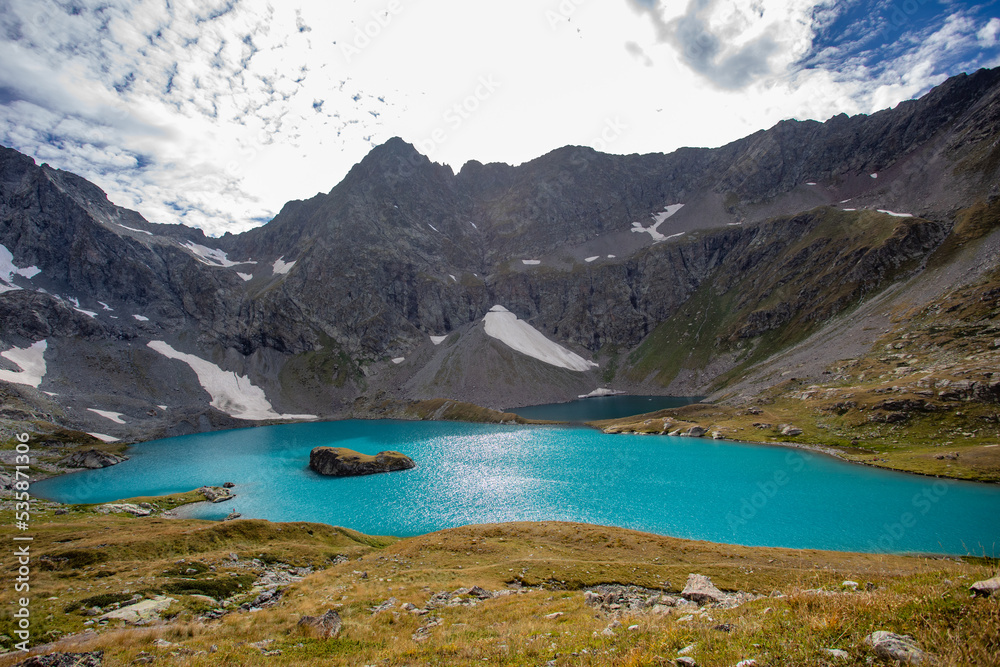 View of a blue mountain lake in the Caucasus Russia against the background of impressive steep mountain peaks