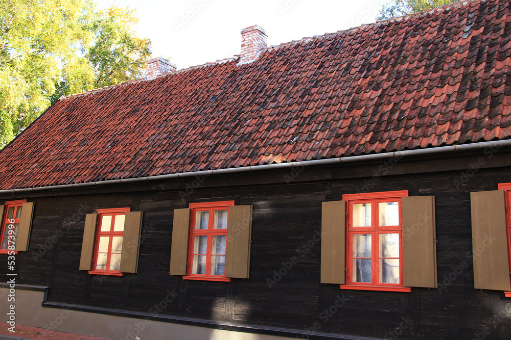 old wooden house with tiled roof
