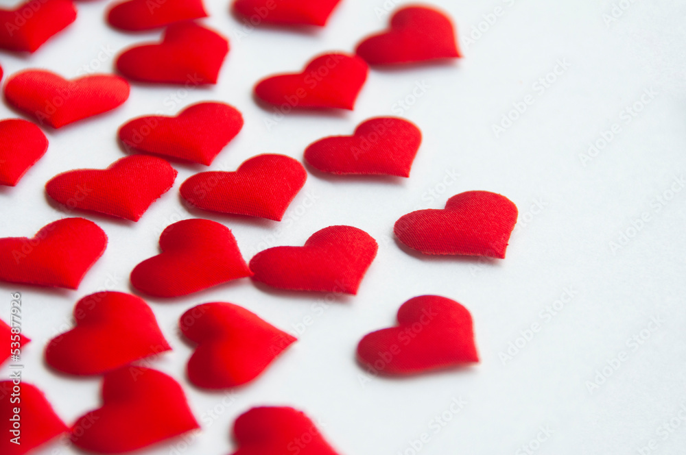Red heart shapes on white background customizable with space for text. Copy space and relationship concept